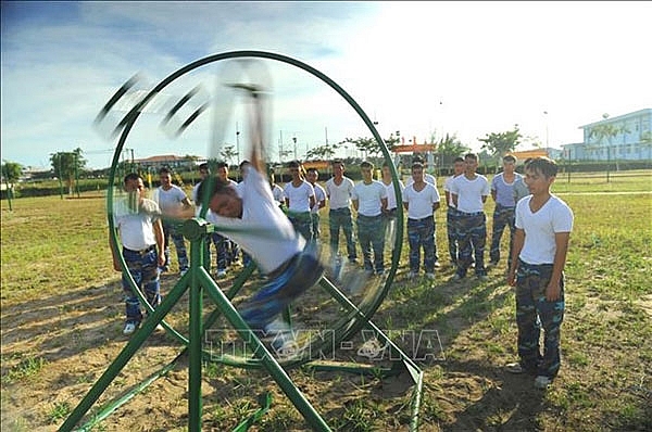 Vietnamese naval troops trained hard on land to cope with dangers at sea