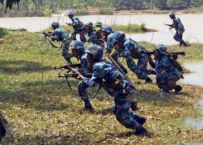 Vietnamese naval troops trained hard on land to cope with dangers at sea