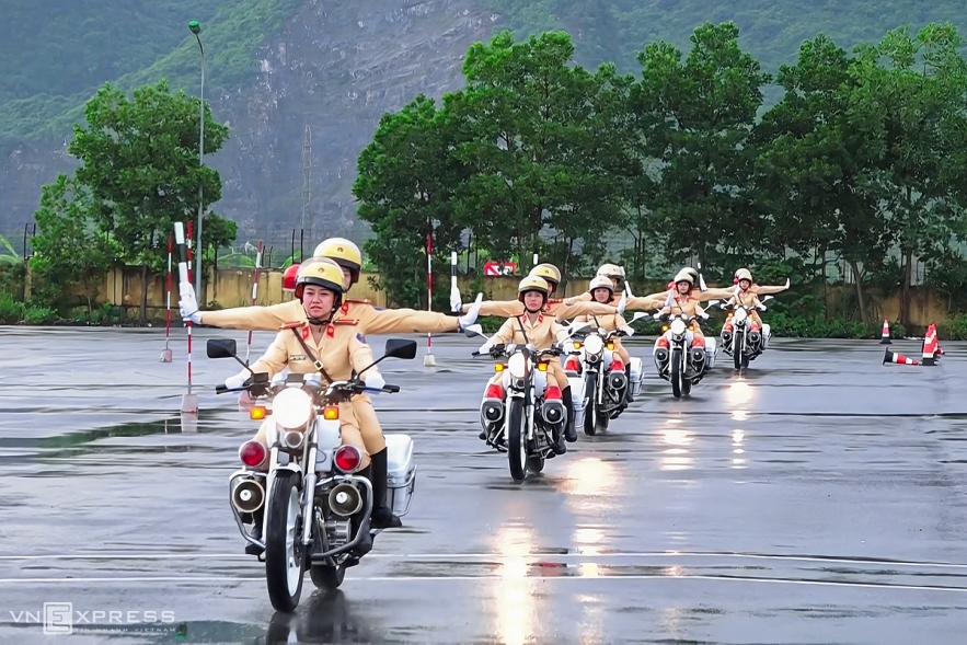 Vietnamese traffic police women exercise to lead groups of delegation by powerful motorcycles.