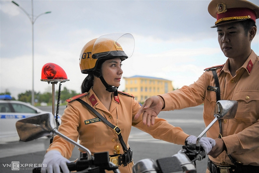 Vietnamese traffic police women exercise to lead groups of delegation by powerful motorcycles.