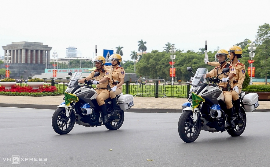 Vietnamese traffic police women exercise to lead groups of delegation by powerful motorcycles.