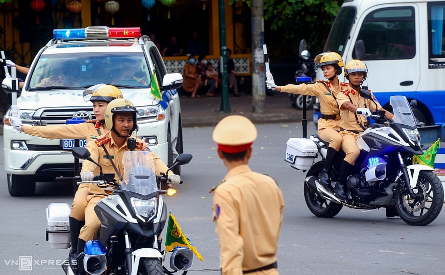 Vietnamese traffic police women exercise to lead groups of delegation by powerful motorcycles.