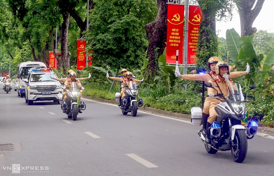 Vietnamese traffic police women exercise to lead groups of delegation by powerful motorcycles.