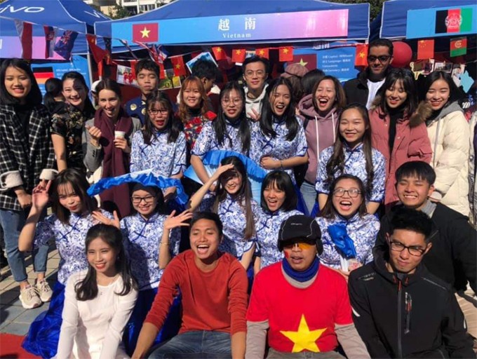Duyen (pink jacket, second from right, top row) and Vietnamese students at a cultural event at Fuzhou University, China's Fujian Province, November 2019. Photo courtesy of Duyen.