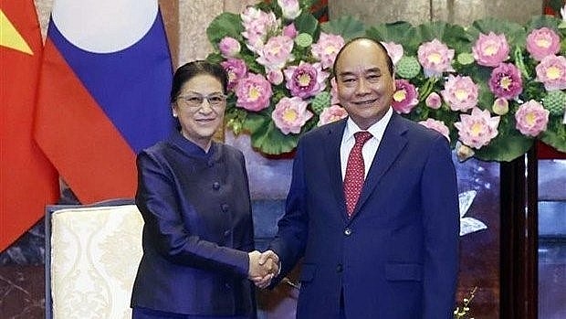 Vietnam and Laos need to maintain the regular exchange of delegations and high-ranking officials and strive to turn economic, trade and investment cooperation into a pillar of bilateral relations, President Nguyen Xuan Phuc said on April 26.
