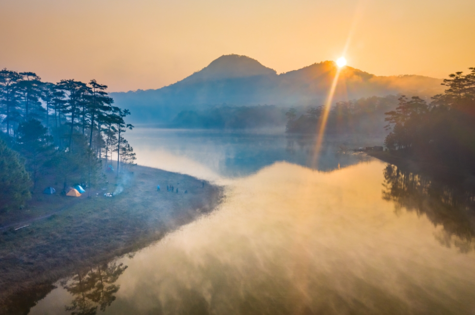 Stunning landscapes of early mist on Tuyen Lam Lake In Da Lat