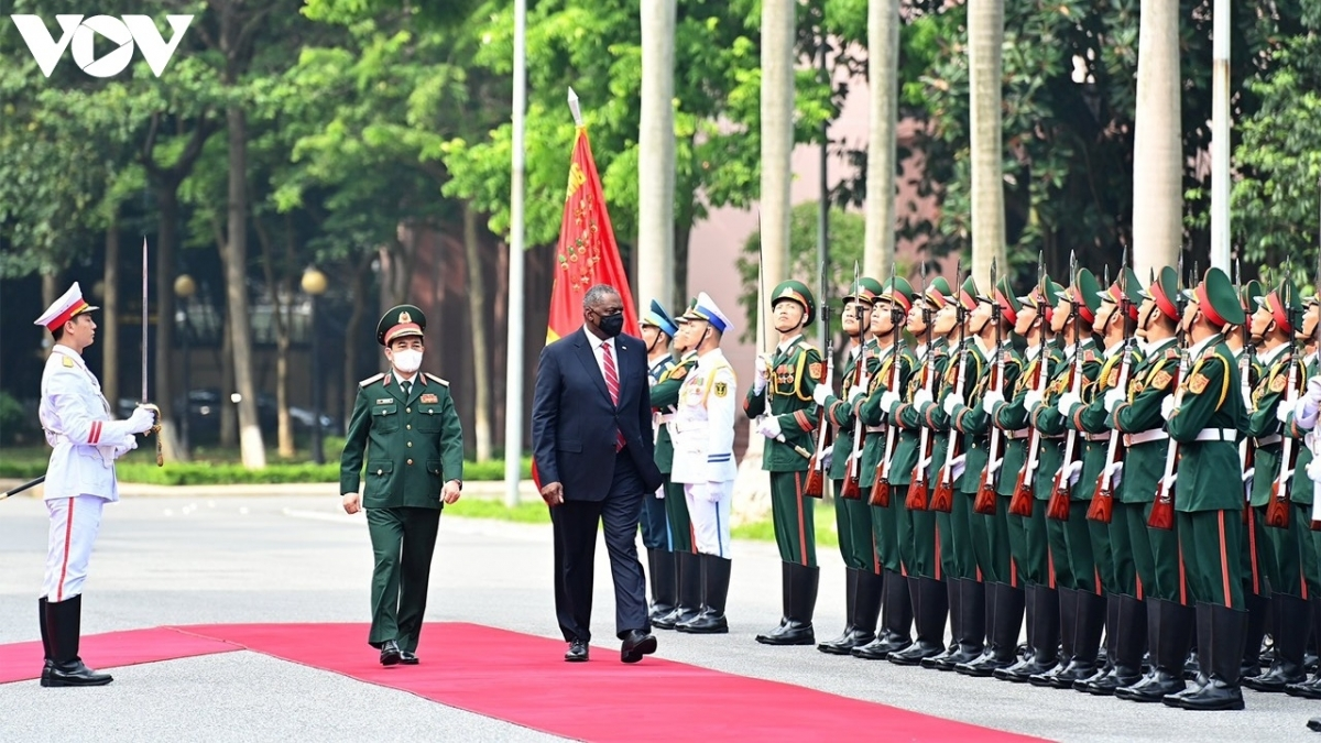Minister Phan Van Giang and Secretary Lloy Austin review the guard of honour in Hanoi on July 29