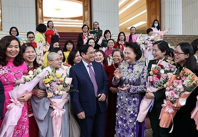 Prime Minister Phạm Minh Chính meets women representatives in Hà Nội on Tuesday on Vietnamese Women's Day (October 20). —VNA