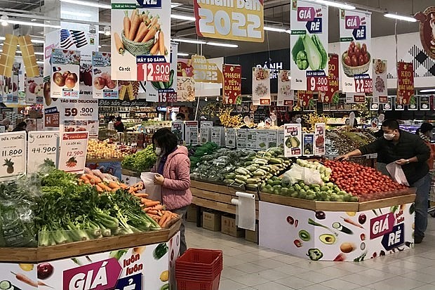 Consumers shop at a supermarket in Hanoi. Photo: VNA