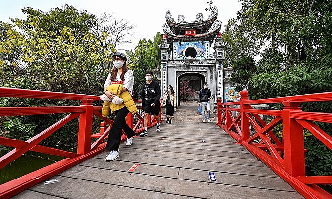 People visit Ngoc Son Temple in Hanoi on February 15, 2022. Photo: VnExpress