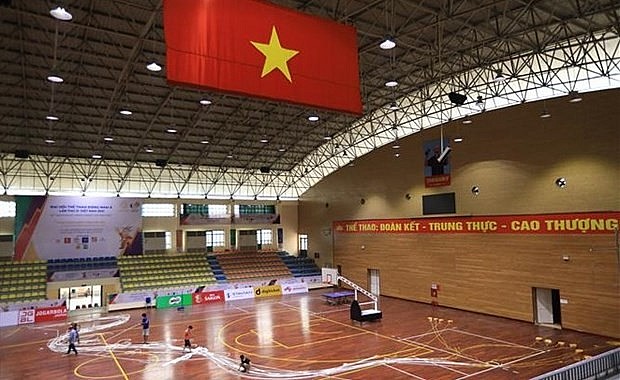 The level of ceiling lights at the Thanh Tri Gymnasium are raised to 1,200 lux as required by the SEA Games 31's basketball matches. Photo: VNA