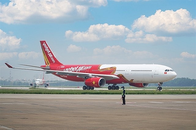  A Vietjet plane lands at Tân Sơn Nhất Airport in HCM City. — Photo courtesy of Vietjet. Photo: VNS