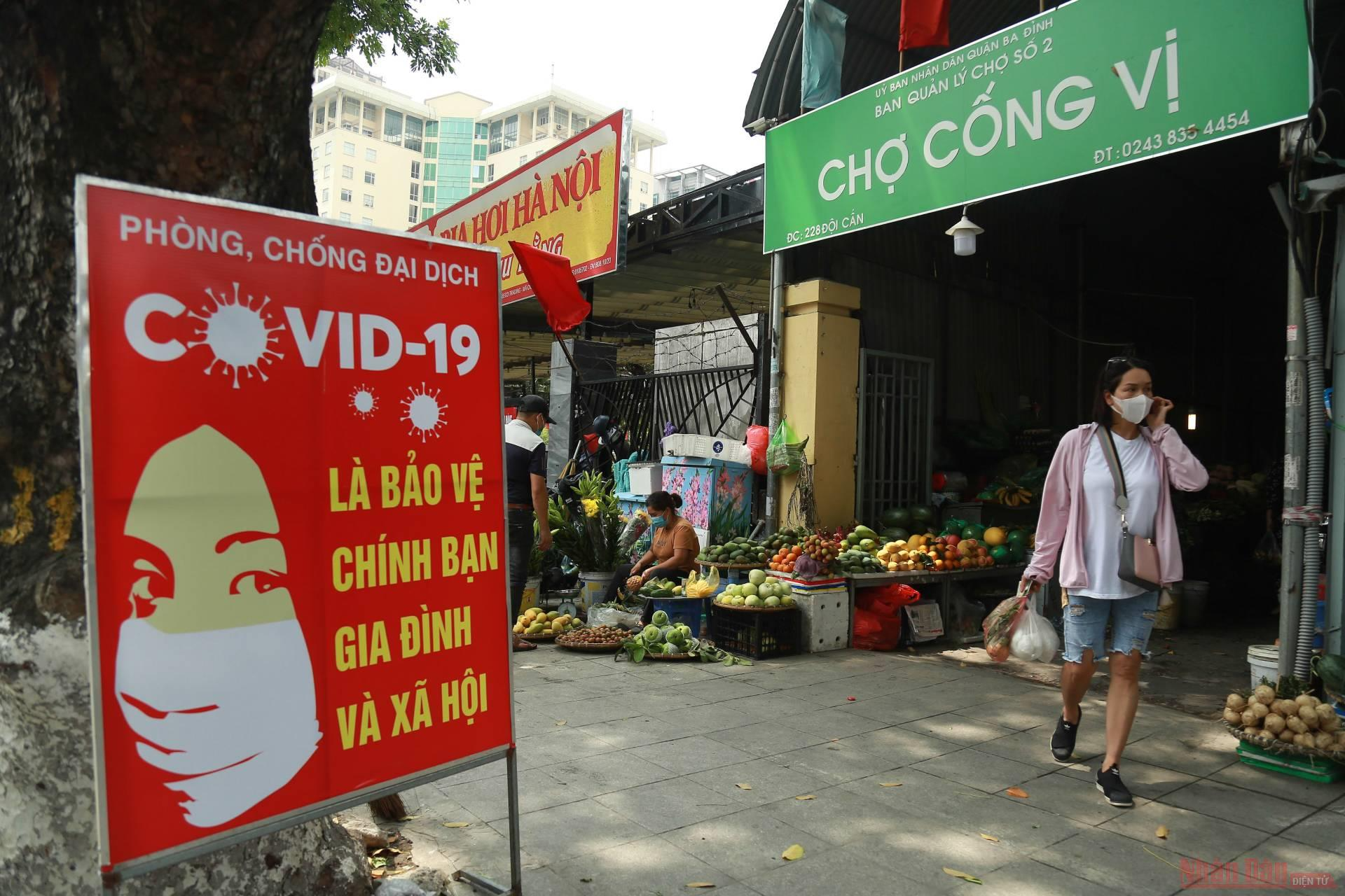 In photo: Shopping in Covid-19 - Put money in bucket, goods in pot