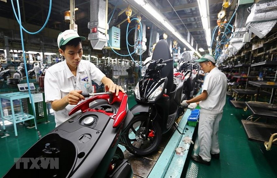 Assemblying motorcycles at Honda Vietnam, one of successful Japanese--run businesses in Vietnam. Photo: VNA