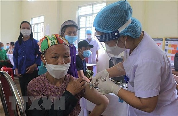 A woman gets vaccinated against Covid-19. Photo: VNA