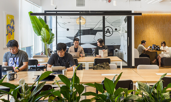 Staff work at a coworking space in HCMC's District 1. Photo: VnExpress