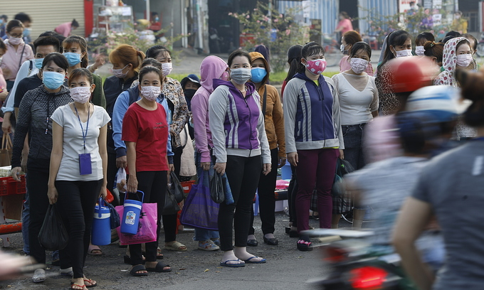 Employees at Pouyuen Vietnam factory in HCMC leave work on June 4, 2021. Photo: VnExpress