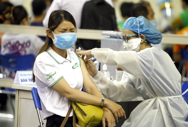 People in HCM City get vaccinated at the Phú Thọ Sport Stadium in District 11 on June 25. Photo: VNS