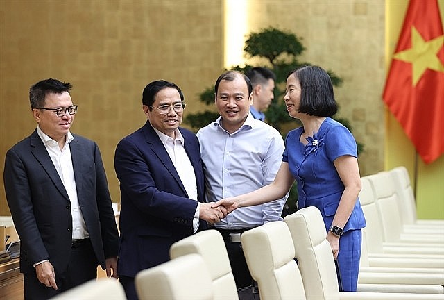 Prime Minister Pham Minh Chinh meets with leaders of press agencies. Photo: VNS 