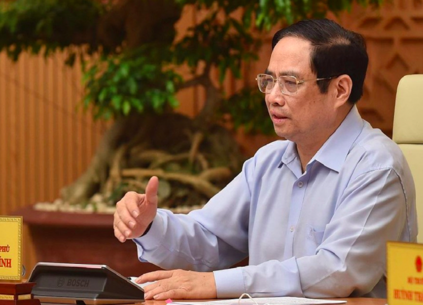 PM Pham Minh Chinh says a greater effort should be made to speed up vaccine research and development so that the first locally produced COVID-19 vaccine is likely to be marketed in September. Photo:VGP