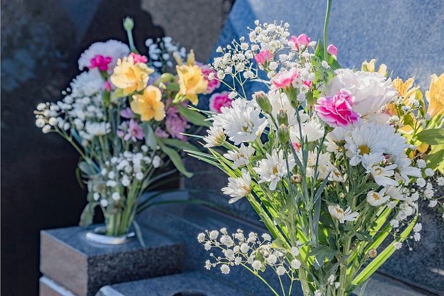 Bring flowers to vidit grave. Photo: Getty Images