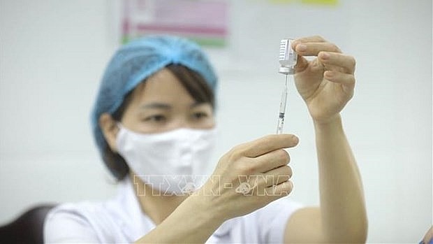 Hanoi plans to vaccinate more than 95 percent of children aged 12 - 17 against Covid-19. Photo: VNA