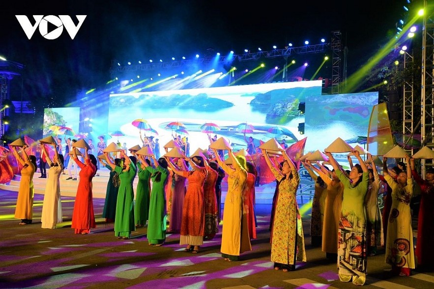 Local women stage a fashion show of Ao Dai at the Tuan Chau international tourism complex. Photo: VOV