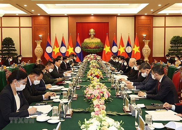 The talks between Vietnamese Party General Secretary Nguyen Phu Trong and Party General Secretary and President of Laos Thongloun Sisoulith in Hanoi in June 2021. Photo: VNA