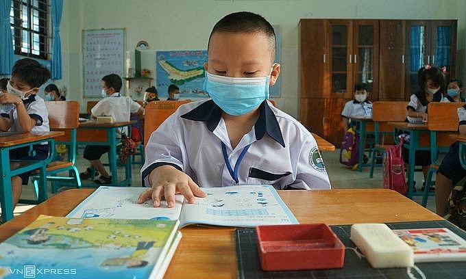 First graders attend an in-person class at Thanh An Primary School in HCMC's outlying district of Can Gio, October 20, 2021. Photo: VnExpress