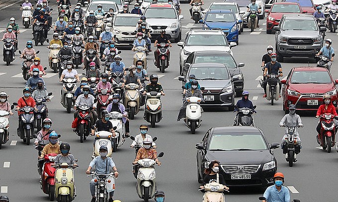 People ride motorbikes on Hanoi's Nguyen Chi Thanh Street, September 2021. Photo: VnExpress