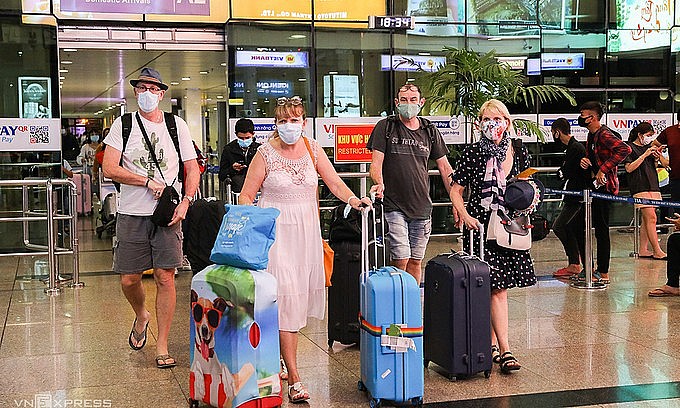 Foreigners arrive at HCMC's Tan Son Nhat Airport, March 2020. Photo: VnExpress
