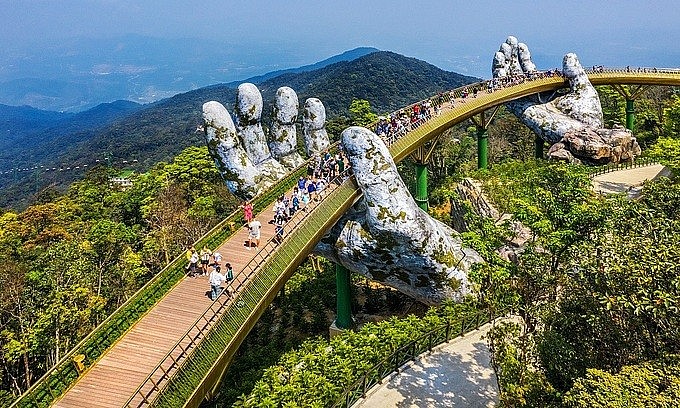 Tourists visit the Golden Bridge on Ba Na Hills in Da Nang, 2019. Photo: Shutterstock