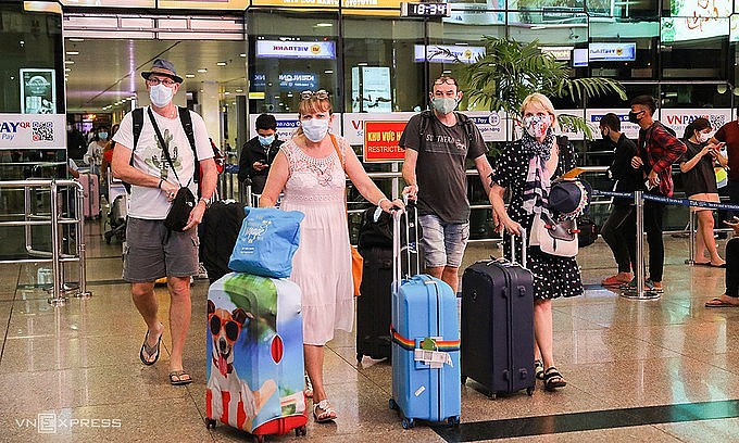Foreigners arrive at HCMC's Tan Son Nhat Airport in March 2020. Photo: VnExpress