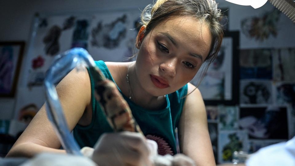 Vietnamese artist helps women cover their scars with tattoos