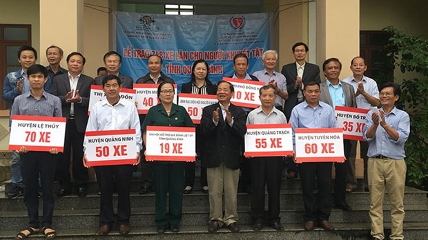 gibtk presents 748 wheelchairs to the disabled in quang binh