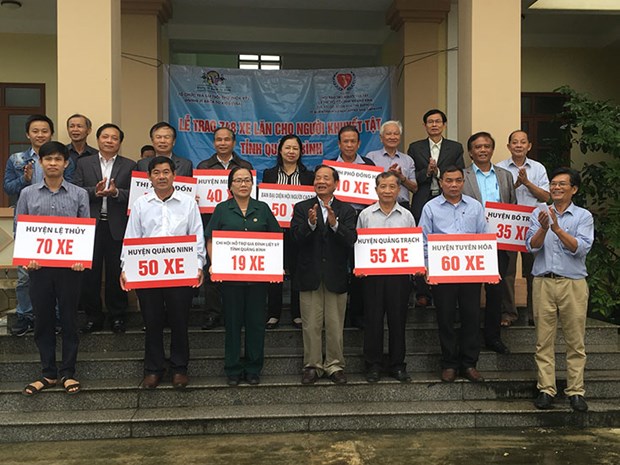 gibtk presents 748 wheelchairs to the disabled in quang binh