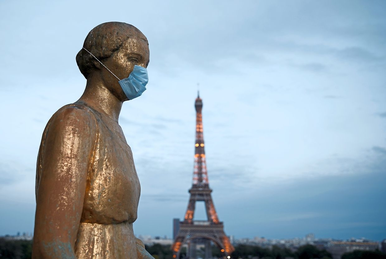 eiffel tower reopens in paris after a 3 month shutdown the longest closure since wwii