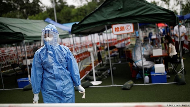 China: over 500,000 people in lockdown as coronavirus cases rise again in Beijing