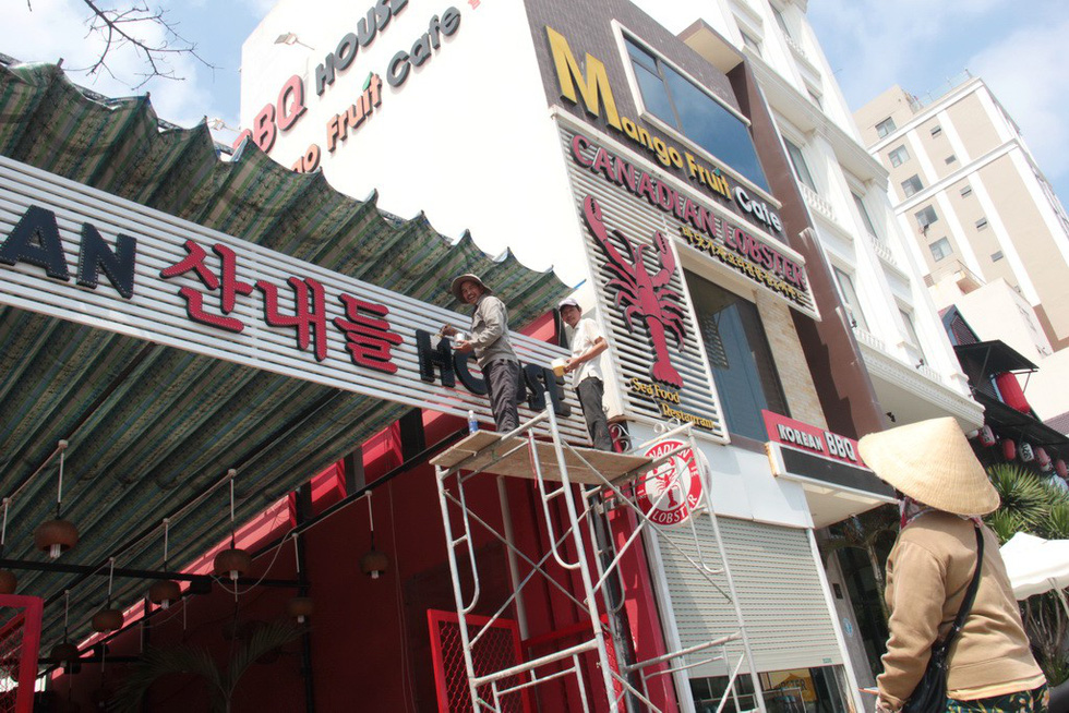 Foreign languages dominate shop signs in Da Nang