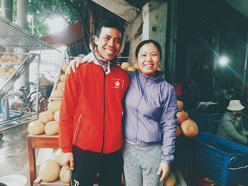 Ha poses with one of the people who helped him along the way. Photo by Ho Nhat Ha