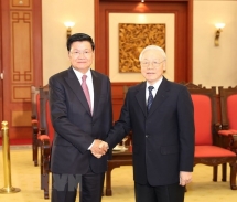 top vietnamese leader welcomes lao prime minister