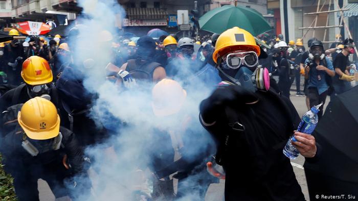 Hong Kong police and protesters rising more violence with tear gas and petrol bombs