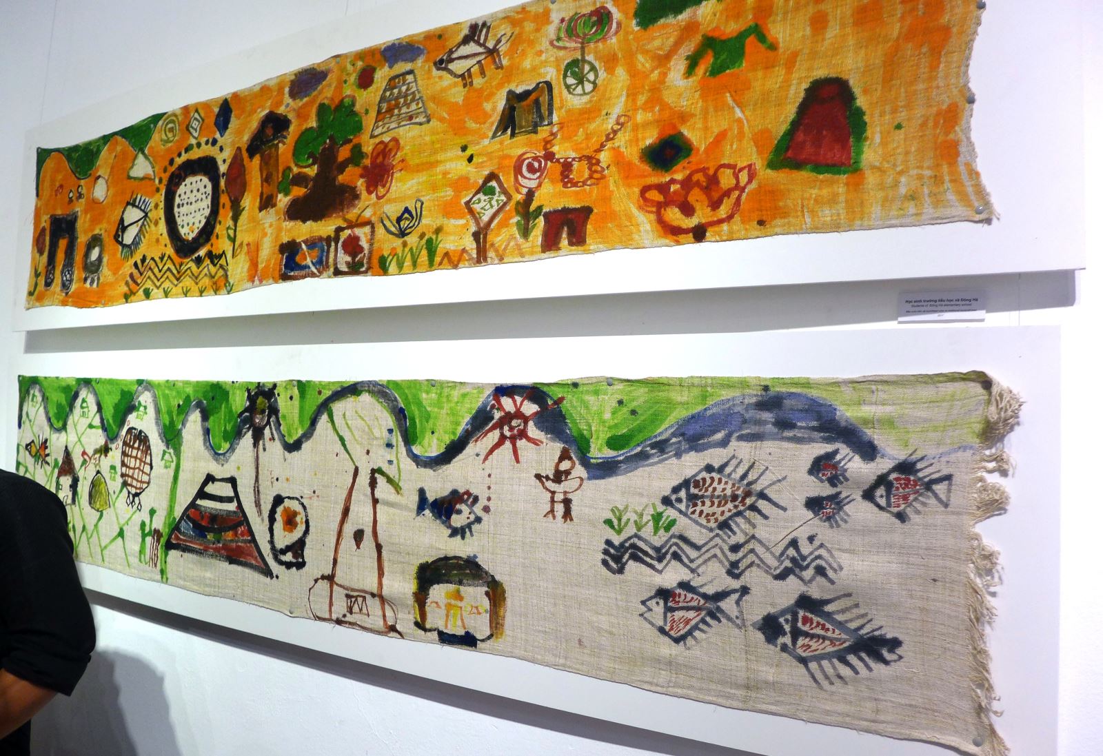 exhibition features ethnic minority childrens paintings on linen