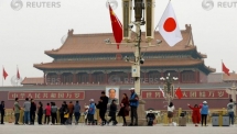 japan pm abe welcomed near tiananmen square in rare china visit